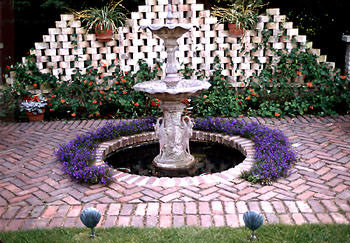 When I designed this patio area, I left a planting strip next to the fountain.  The Lobelia always worked good in this spot.  (This is a very old (circa 2000) low res image)